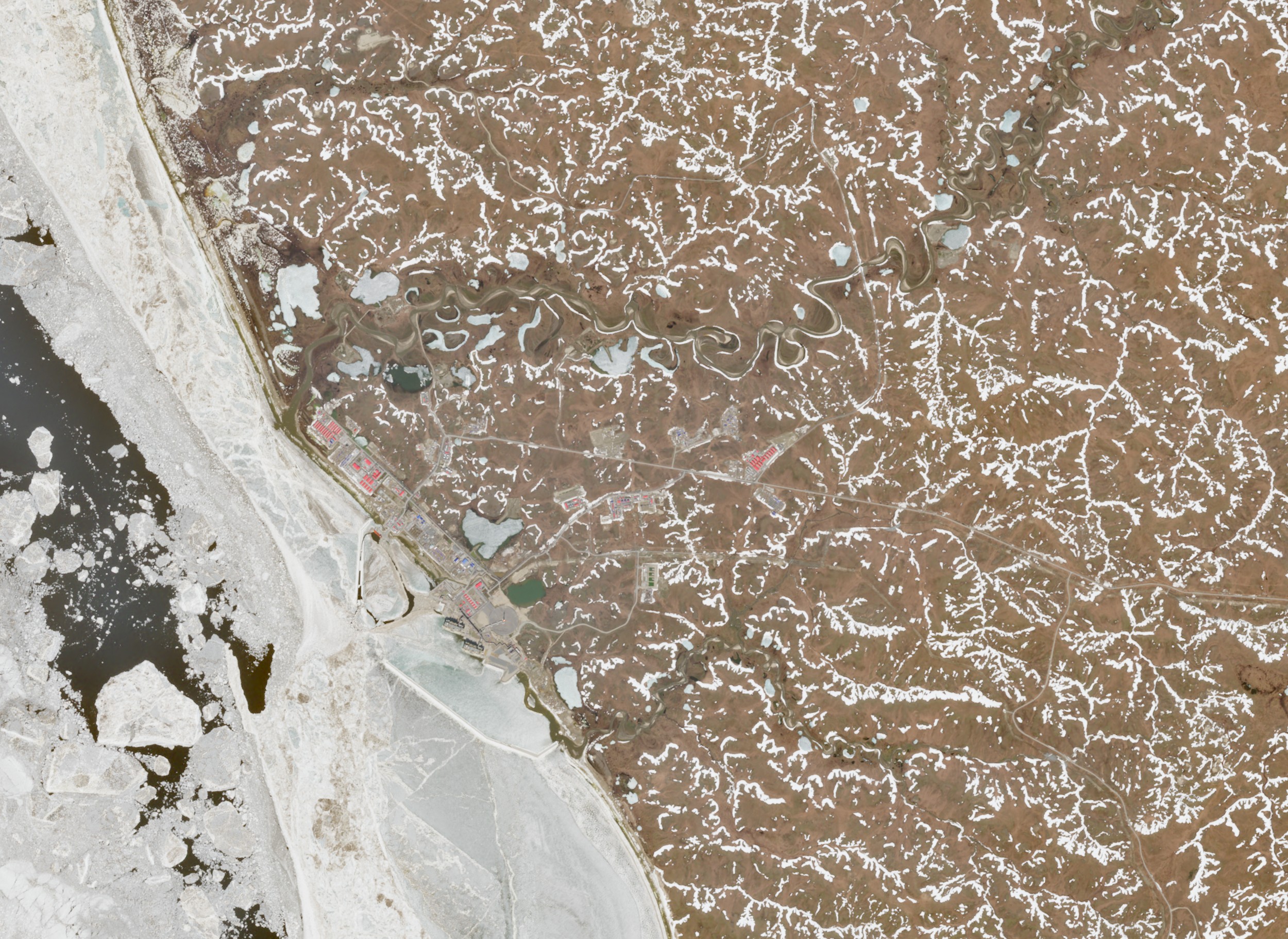 Satellite view of an industrial coastal refinery